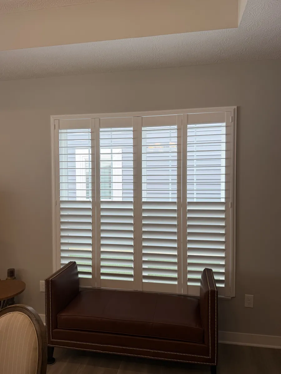 White custom plantation shutters on a wide four-panel window in a Plain City, Ohio home